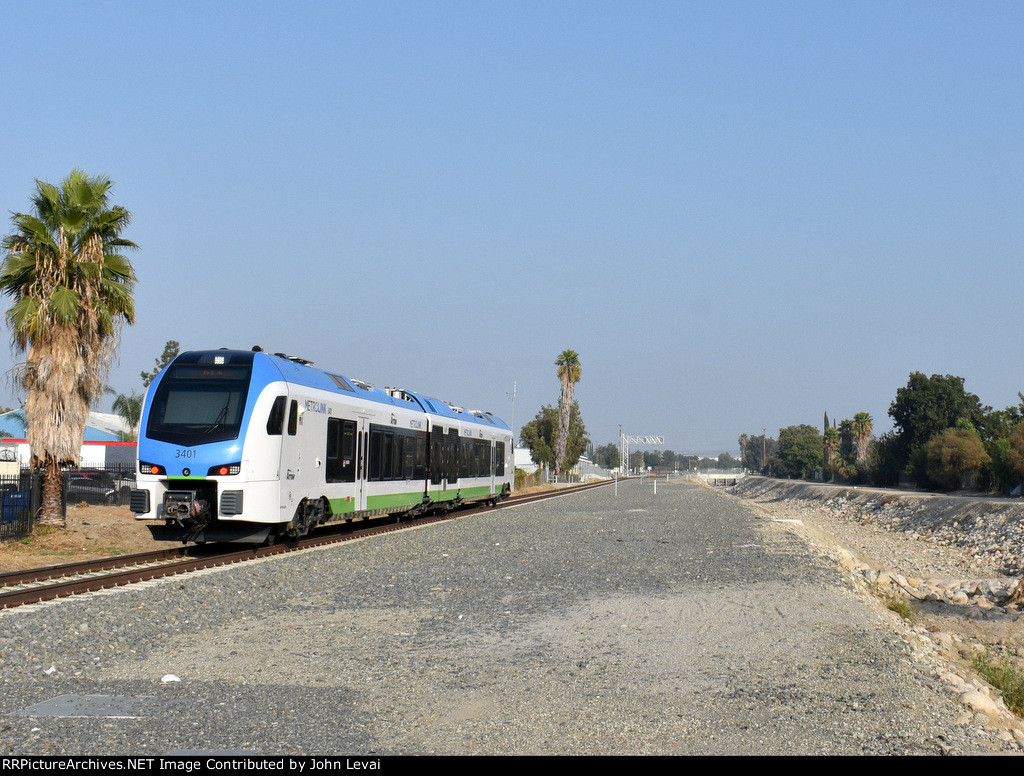 Car # 3401 heading away from San Bernardino Tippercanoe Station toward Redlands     